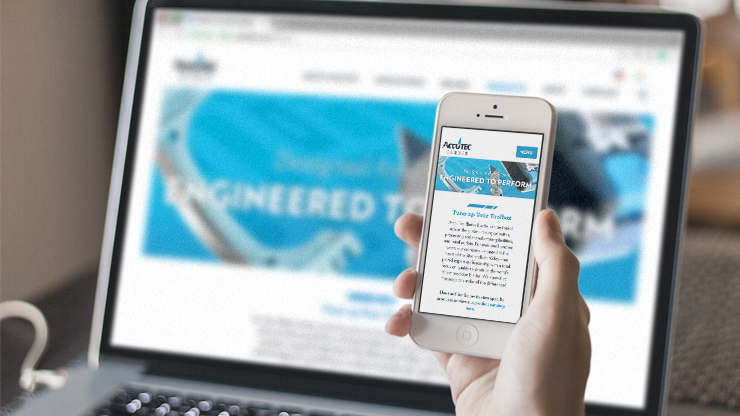The new AccuTEC website displaying on a laptop and iPhone