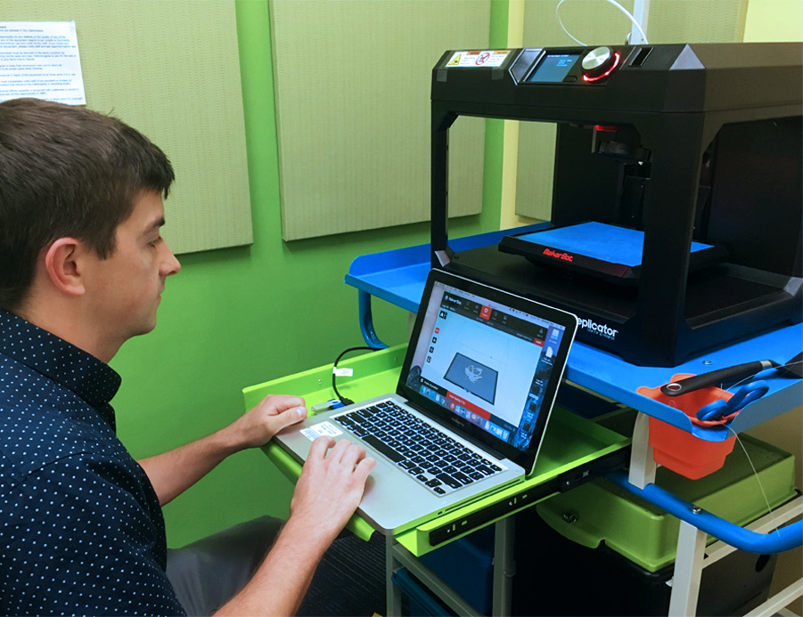 Landon Dorrier in Northside Library's MakerSpace Studio for 3-D printing