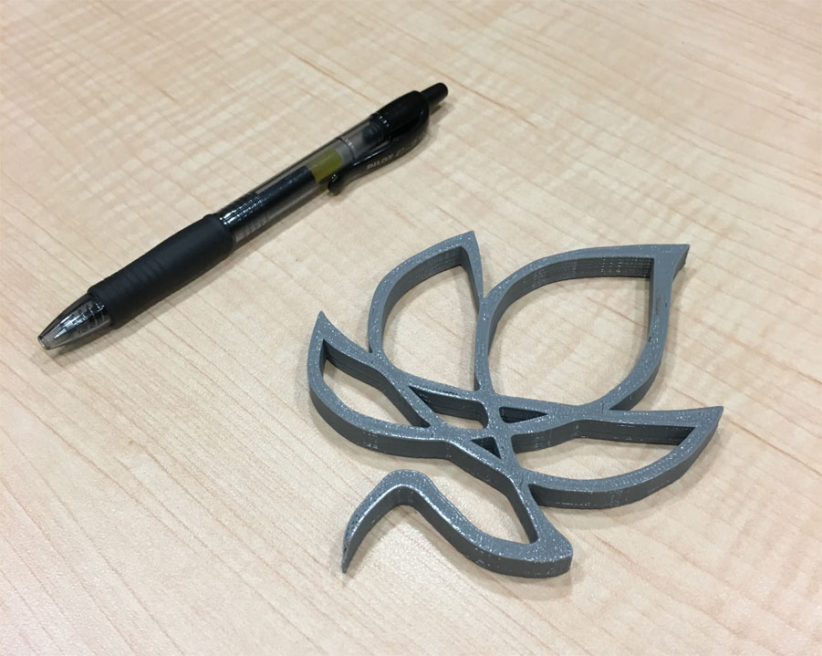 Ivy leaf 3D printed product next to pen for size comparison