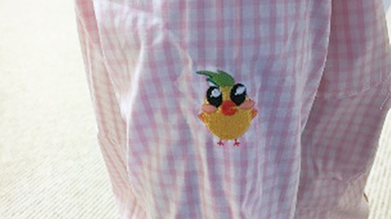 Marketing campaign mascot embroidered on a dress shirt sleeve