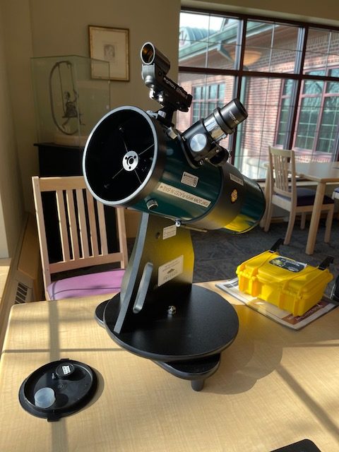 A telescope displayed on a desk